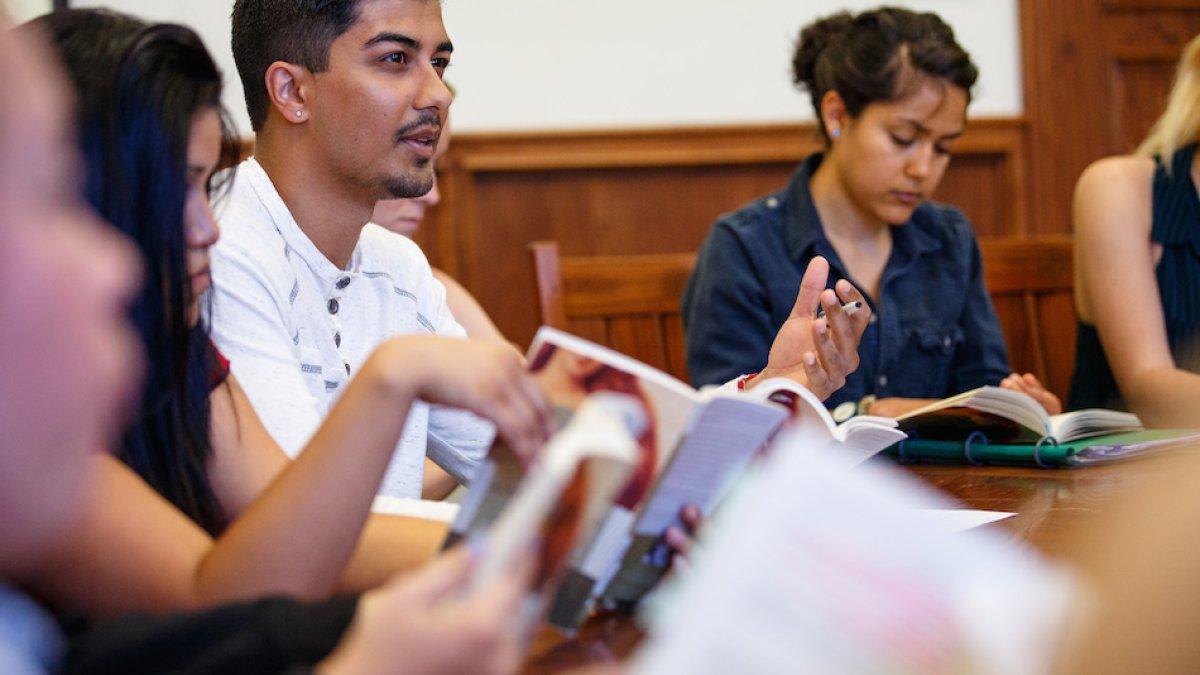 Students in Seminar class discussing a book